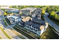 Stunning aerial view of a modern townhouse community with manicured landscaping and convenient access to nearby amenities at 6666 Sterling Dr, Sandy Springs, GA 30328