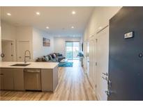 Bright living space featuring an open concept layout with a modern kitchen and comfortable seating area at 1155 Custer Se Ave # 201, Atlanta, GA 30316