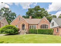 Charming brick home with manicured lawn and mature trees in desirable neighborhood at 1216 Beech Valley Ne Rd, Atlanta, GA 30306