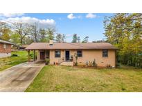 Charming brick home with well-maintained front yard and inviting curb appeal at 338 Patricia Sw Ave, Marietta, GA 30060