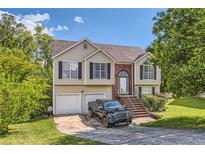 Traditional two-story home with a well-maintained front yard and attached two-car garage at 7450 Chads Cir, Jonesboro, GA 30236