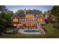 Stunning backyard with pool, firepit, lush landscaping, and multi-level deck at 177 Grandmar Chase, Canton, GA 30115