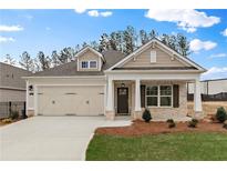 Charming single-Gathering home with a well-manicured lawn, two-car garage, and a welcoming front porch at 1216 Cedarcrest Blvd, Acworth, GA 30101