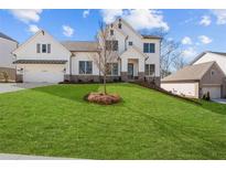 Beautiful two-story home featuring a manicured lawn and attached two car garage at 2023 Fern Mountain Ln, Marietta, GA 30064