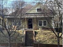 Charming two-story home with a covered front porch and inviting curb appeal at 939 Hank Aaron Sw Dr, Atlanta, GA 30315