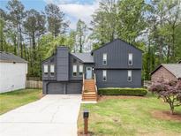Charming two-story home featuring a modern exterior, well-manicured lawn, and inviting curb appeal at 315 Mckees Rock Ln, Lawrenceville, GA 30044