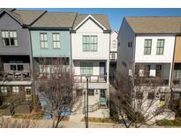 Beautiful townhomes feature colorful facades and inviting front porches at 711 Needletail Way, Atlanta, GA 30312