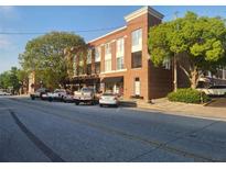Charming brick building with street parking and mature trees at 1133 Church St # 6, Covington, GA 30014