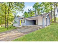 Charming two-story home with covered parking and a welcoming front porch at 3839 Rosedale Ln, Douglasville, GA 30135
