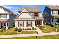 Charming two-story home featuring manicured lawn and lovely front porch at 637 Sunflower Dr, Canton, GA 30114