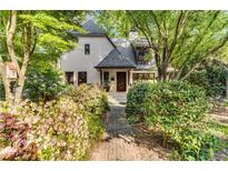 Charming brick home featuring a landscaped front yard and a welcoming entrance at 2287 Armand Ne Rd, Atlanta, GA 30324