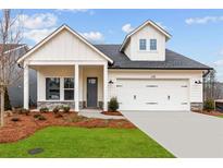 Charming home featuring white siding, stone accents, and a convenient two-car garage at 235 Strawberry Ln, Woodstock, GA 30189