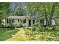 Charming ranch-style home with a well-manicured lawn and mature trees at 2920 Appling Dr, Atlanta, GA 30341