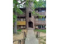 Unique apartment building featuring a turret and multiple balconies, creating an inviting and distinctive living space at 1316 Camelot Dr, College Park, GA 30349