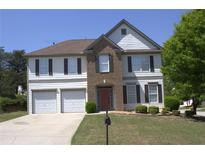 Charming two-story home featuring a well-maintained lawn and inviting facade at 3152 Spruce Way, Atlanta, GA 30349