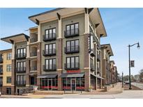 Contemporary four-story apartment building boasting private balconies and street-level commercial spaces at 5300 Peachtree Rd # 3601, Atlanta, GA 30341