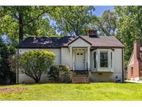 Charming single-story home with a welcoming front entrance and well-maintained landscaping at 536 Trabert Nw Ave, Atlanta, GA 30309