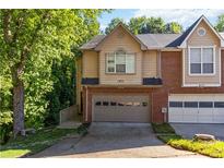 Charming townhome with well-manicured lawn and attached garage at 873 Edgewater Cir, Marietta, GA 30062