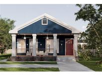 Charming blue cottage with inviting front porch and a red front door at 995 Sw Sparks St, Atlanta, GA 30310