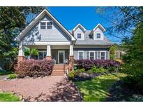 Charming home with inviting front porch and beautiful landscaping at 414 Pensdale Rd, Decatur, GA 30030