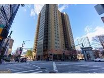 View of the building from the street showing its height and urban location at 300 Peachtree Ne St # 5A, Atlanta, GA 30308