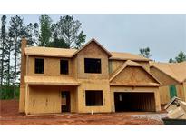 Unfinished exterior view of a two-story home with a two-car garage and wood-frame construction at 488 Charleston Pl, Villa Rica, GA 30180