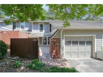 Charming townhouse featuring a garage, fenced courtyard, and lovely landscaping at 5058 Meadow Ne Ln, Marietta, GA 30068