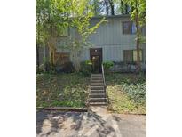 Two-story exterior featuring beautiful greenery and a welcoming front entrance at 908 Pine Oak Trl, Austell, GA 30168