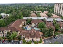 Stunning aerial view of community, showcasing the pool, landscaping, and architecture at 3777 Peachtree Ne Rd # 1536, Atlanta, GA 30319