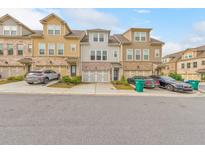 Charming townhome with brick accents, a two-car garage, and well-maintained landscaping in a desirable community at 6304 Brookwater Vw, Mableton, GA 30126