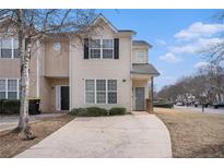 Charming townhouse with a well-maintained lawn and private driveway at 2326 Nicole Dr, Hampton, GA 30228