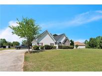 Charming single-Gathering home featuring a spacious front yard and a serene suburban setting at 152 Ridge Xing, Temple, GA 30179