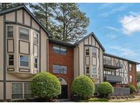 Lovely multi-Gathering residential exterior displaying a two-story facade with a charming brick accent and manicured greenery at 6851 Roswell Rd # C7, Atlanta, GA 30328