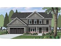 Charming two-story home features a dark gray exterior, a two-car garage, and a well-manicured front yard at 1238 Cherry Bark Ct, Loganville, GA 30052