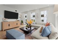 Bright living room with a comfortable sectional sofa, modern decor, and plenty of natural light at 1765 Beckham Ne Pl # 53, Atlanta, GA 30324