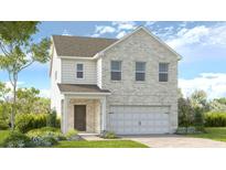 Charming two-story home featuring a light brick facade and attached two-car garage at 4191 Brindle Pl, Loganville, GA 30052