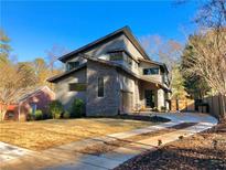 Beautiful contemporary two-story home with manicured lawn and a long private driveway at 246 Garland Ave, Decatur, GA 30030