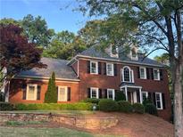 Beautiful brick home featuring manicured landscaping and a well-maintained front yard at 4047 Jordan Lake Dr, Marietta, GA 30062