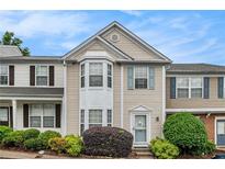 Charming townhouse with bay window, light siding, and manicured landscaping in a well-maintained community at 1310 Kilmington Ct, Alpharetta, GA 30009
