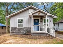Charming bungalow with updated siding and a welcoming front porch with star detail at 3378 Lavista Dr, Atlanta, GA 30354