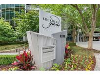 Buckhead Grand Condominiums sign with well-maintained landscaping and visible address at 3338 Peachtree Ne Rd # 1010, Atlanta, GA 30326