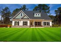Charming single-Gathering home with a well-manicured lawn and inviting facade in a suburban setting at 1411 Stephens View Dr, Loganville, GA 30052