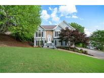 Charming home with a well-manicured lawn, beautiful landscaping and traditional architectural details at 31 Clearview Dr, Cartersville, GA 30121