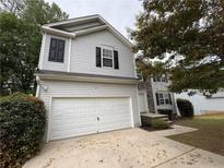 Charming two-story home with a two-car garage and stone accents at 110 Slate Ridge Ln, Loganville, GA 30052