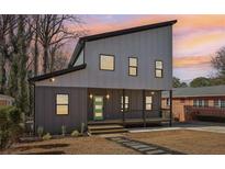 Charming home featuring a modern design, gray siding, and inviting front porch at 665 Ferris St, Atlanta, GA 30310