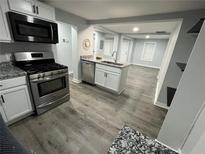 Modern kitchen with stainless steel appliances, granite countertops, and an open layout perfect for entertaining at 2040 Penelope Nw St, Atlanta, GA 30314