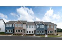 New townhome exteriors showcasing brick, blue siding, and multiple windows, offering a modern look at 5106 Arista Dr, Douglasville, GA 30135