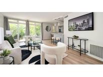 Bright living room with modern decor, stylish furniture, and large windows offering ample natural light at 120 Alden Nw Ave # D2, Atlanta, GA 30309