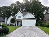 Charming one-story home with a beautiful driveway and a well maintained landscaped yard at 3850 Laurel Nw Dr, Acworth, GA 30101