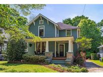 Charming two-story home with a welcoming front porch, stone accents and landscaped yard at 167 E Lake Se Ter, Atlanta, GA 30317